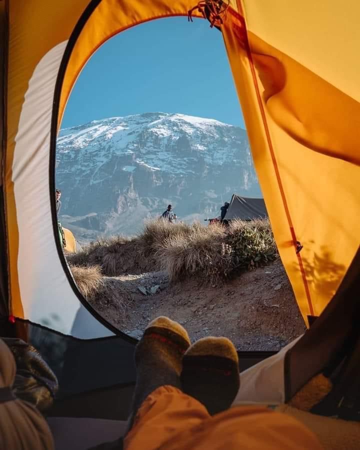 Not everyone comes to Kilimanjaro for the mountain.

Some come to prove something to themselves.
Some come searching for...